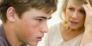 Teenager listening to mother speak